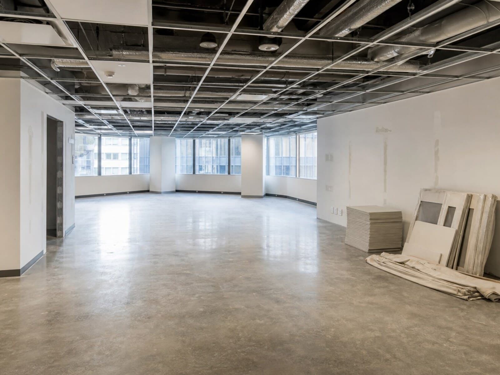 A cleared commercial tenancy with patched walls, repaired ceilings, and fresh paint prepared for a lease make good handover inspection.